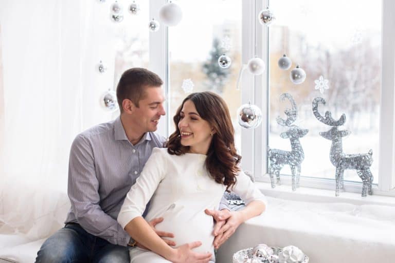 Husband sitting with pregnant wife