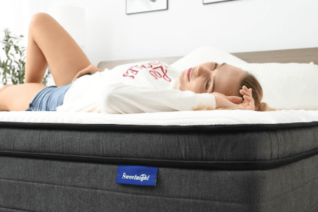 A back sleeper on a very comfy bed