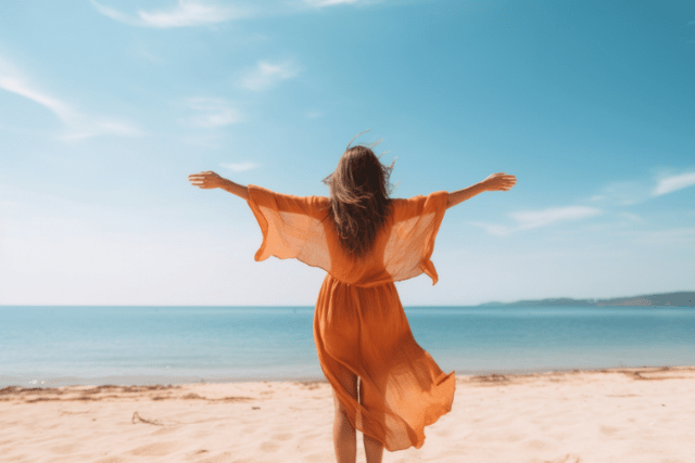 happy woman with arms outstretched